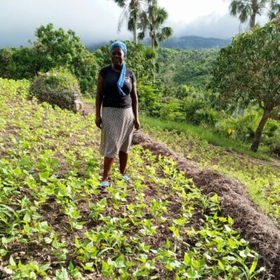 Woman in field with erosion barrier